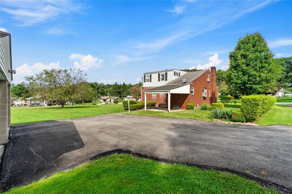 1268 Old State Road Apollo, PA 15613 - Photo 3 of 22 a view of a big house with a big yard and potted plants