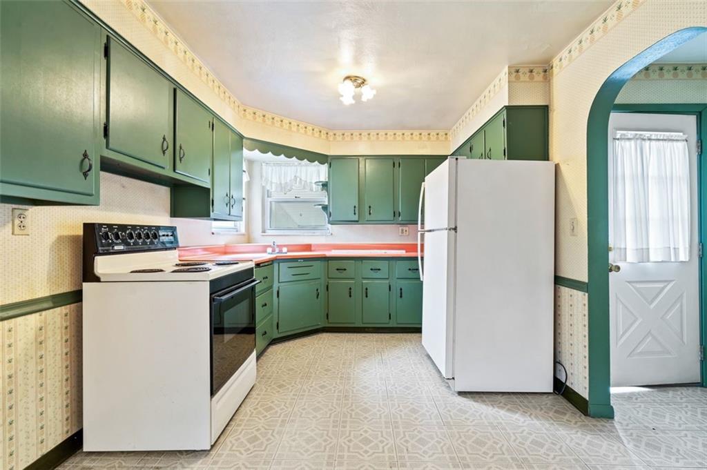 1268 Old State Road Apollo, PA 15613 - Photo 5 of 22 a kitchen with a refrigerator a sink dishwasher and a stove