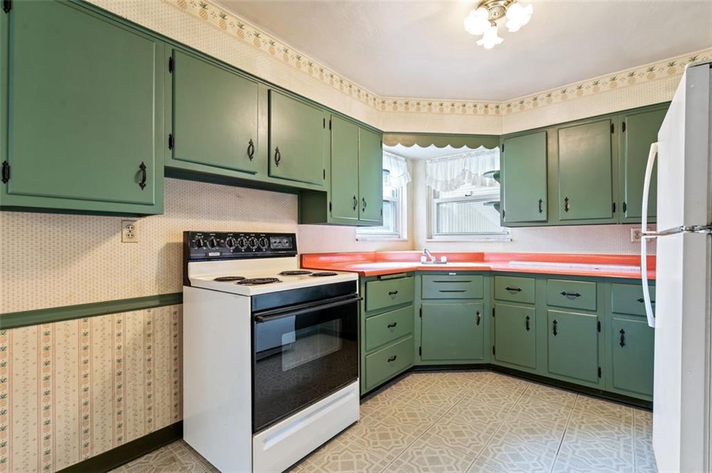 1268 Old State Road Apollo, PA 15613 - Photo 6 of 22 a kitchen with cabinets a sink and a stove