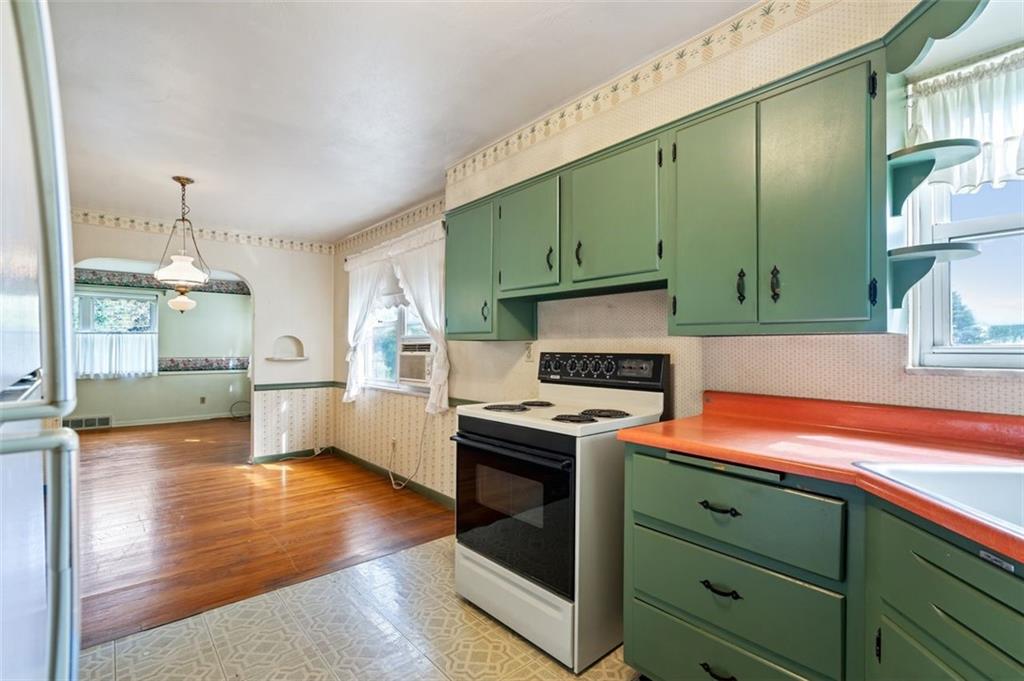 1268 Old State Road Apollo, PA 15613 - Photo 7 of 22 a kitchen with a stove and a wooden floors