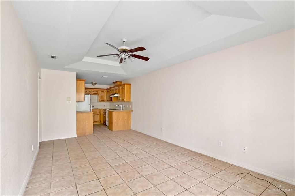 4006 Inspiration Road, Unit 2 Mission, TX 78573 - Photo 6 of 15 a view of a kitchen with a sink and a refrigerator