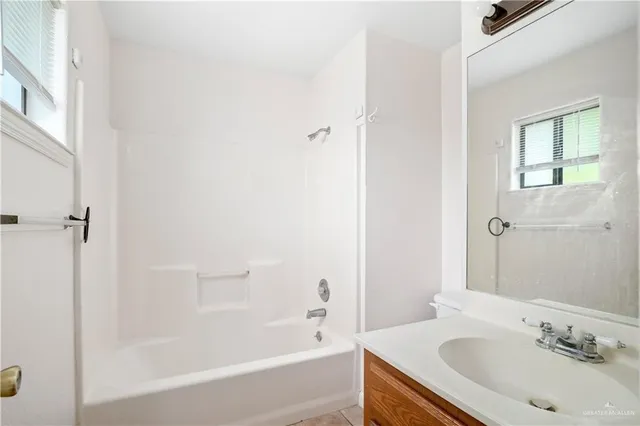a bathroom with a sink and a bathtub