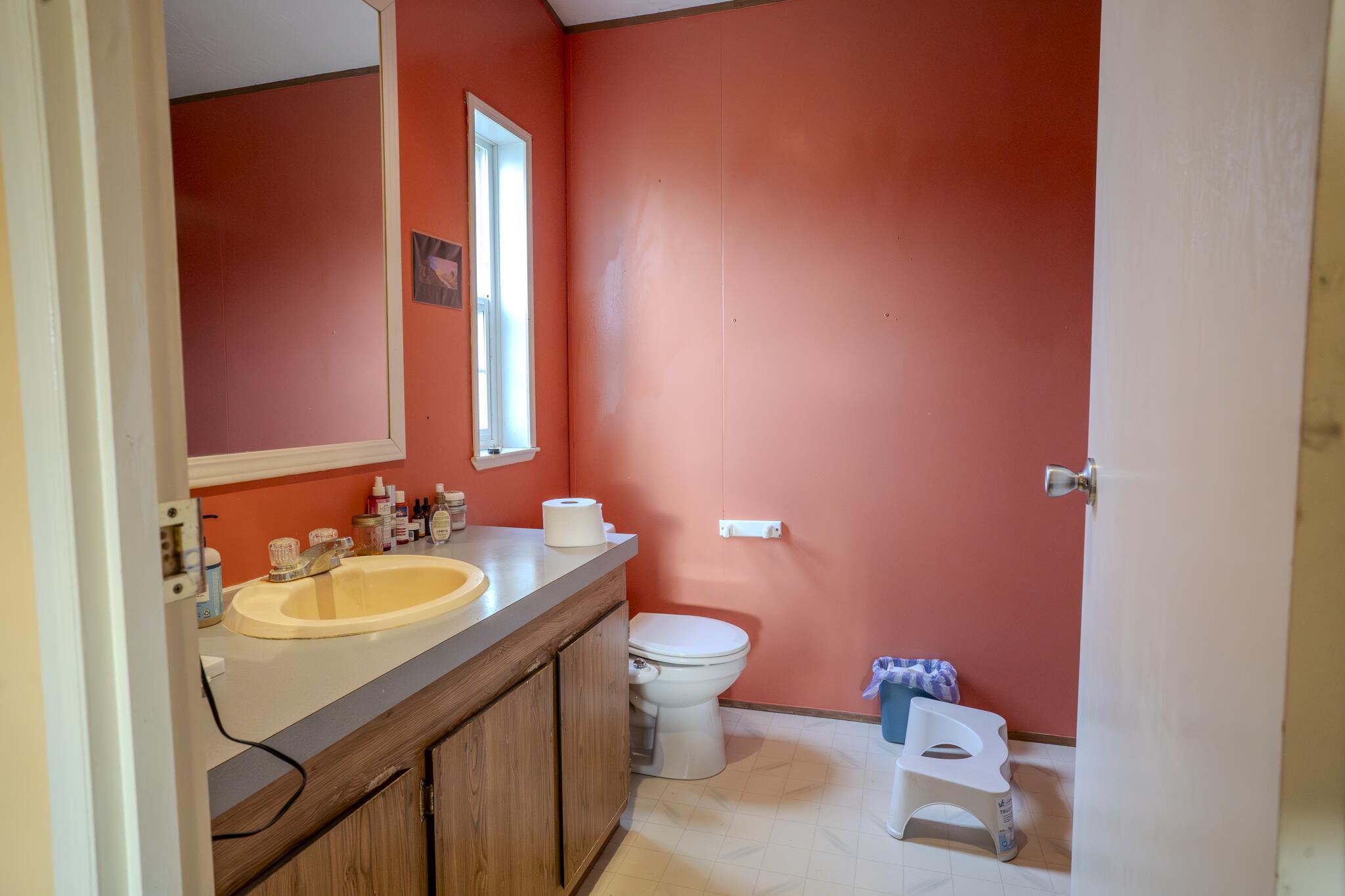 362 Humbug Creek Road Jacksonville, OR 97530 - Photo 14 of 49 a bathroom with a sink a toilet and mirror
