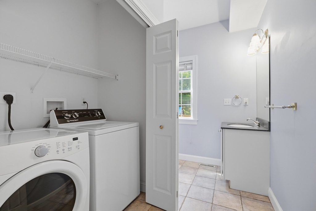 61 Indian Head Road Framingham, MA 01701 - Photo 32 of 42 a utility room with dryer and washer