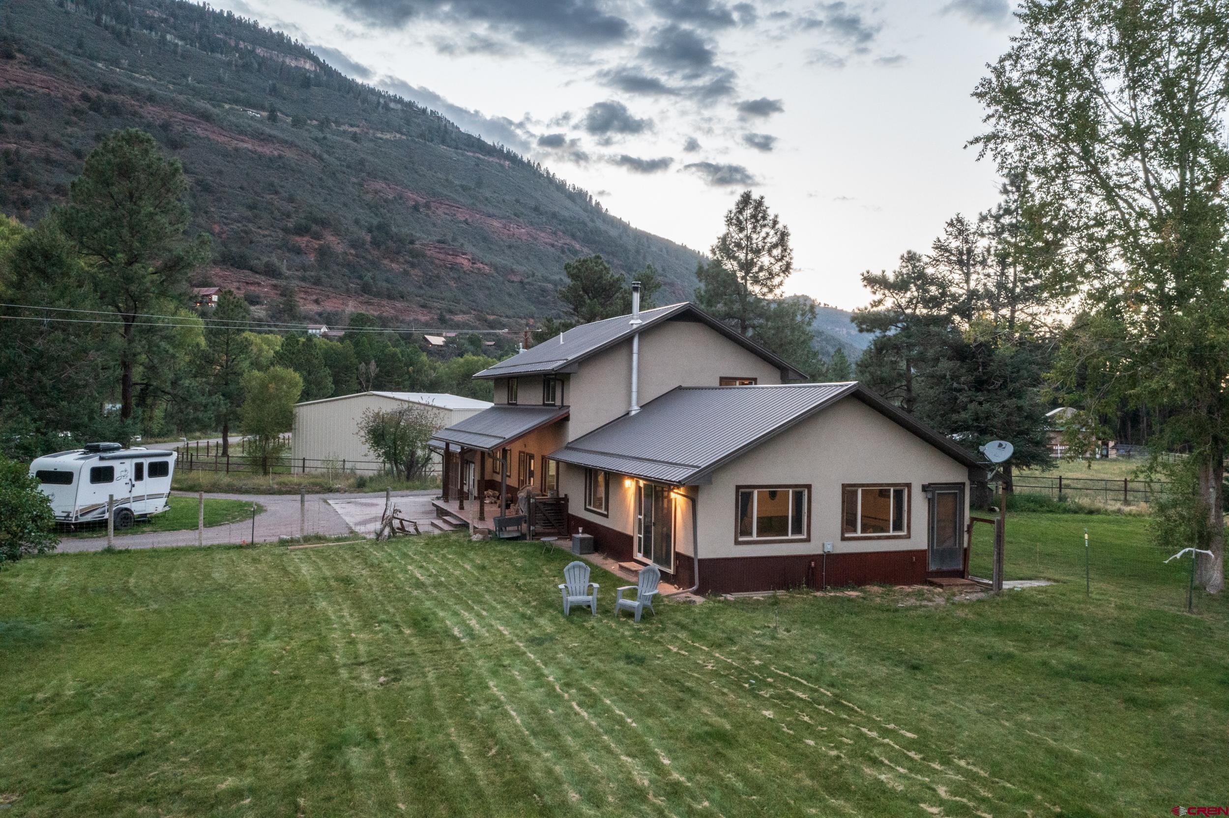 559 Suzanne Lane Ridgway, CO 81432 - Photo 32 of 45 a front view of a house with garden