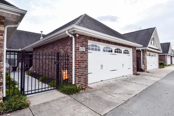 a front view of a house with garage