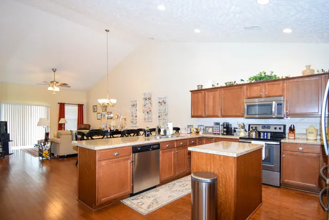 a kitchen with lots of counter top space and appliances