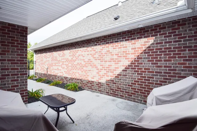a view of a chairs and table in a patio