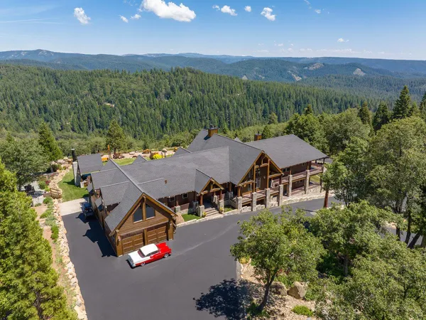 an aerial view of residential houses and outdoor space