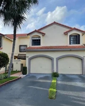 a dining room with a table and chairs