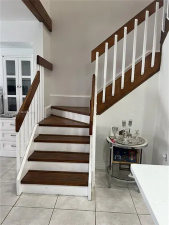 a bathroom with a toilet a sink a vanity and mirror