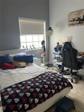 a bedroom with furniture and a chandelier