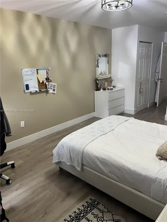 a living room with a bed and furniture