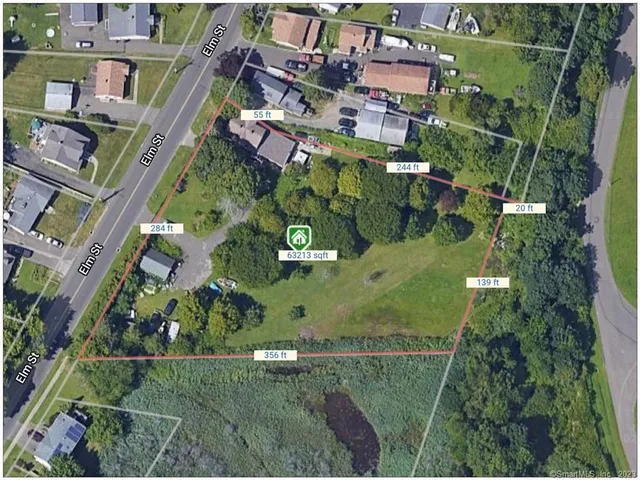 an aerial view of houses with outdoor space