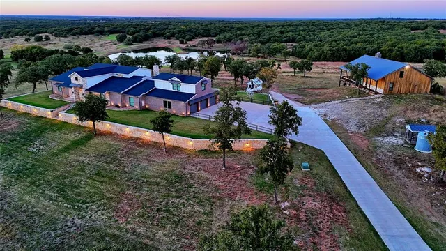 aerial view of a house with a yard