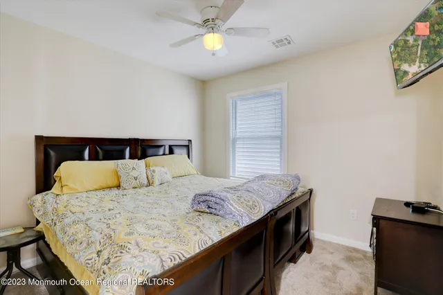 a bedroom with a bed and lamps