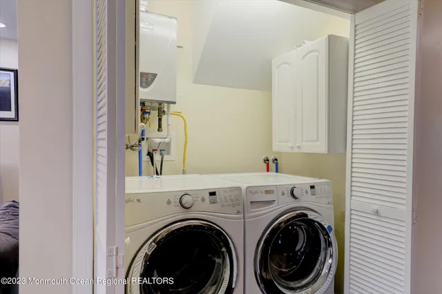 a view of hallway with washer and dryer