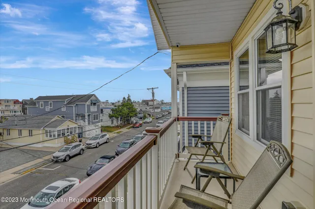 a balcony view with couple of chairs