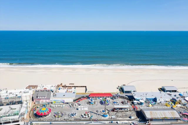 a view of a balcony with wooden floor and iron stairs