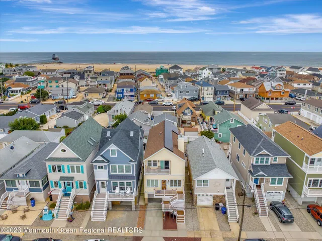 an aerial view of residential houses and city street