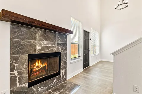 a living room with a fireplace