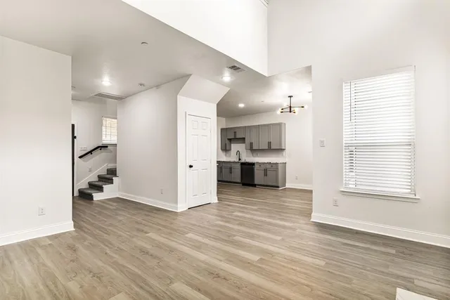 a view of a kitchen with a stove cabinets and wooden floor