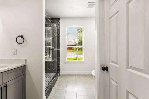 a view of an empty room with a window