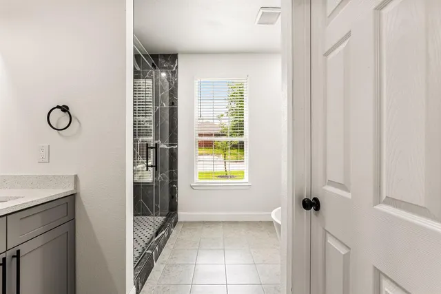 a view of an empty room with a window