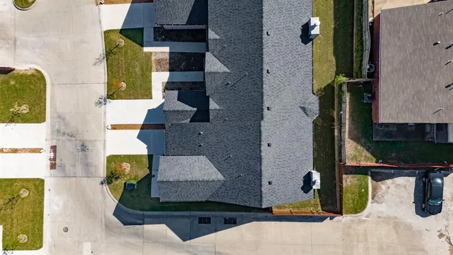 an aerial view of residential houses with outdoor space