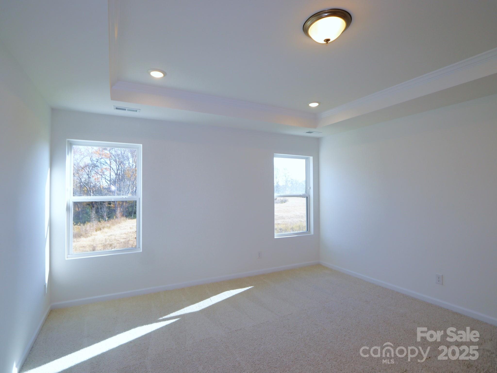 759 Kitfox Drive Northwest Concord, NC 28027 - Photo 13 of 19 a view of empty room with windows