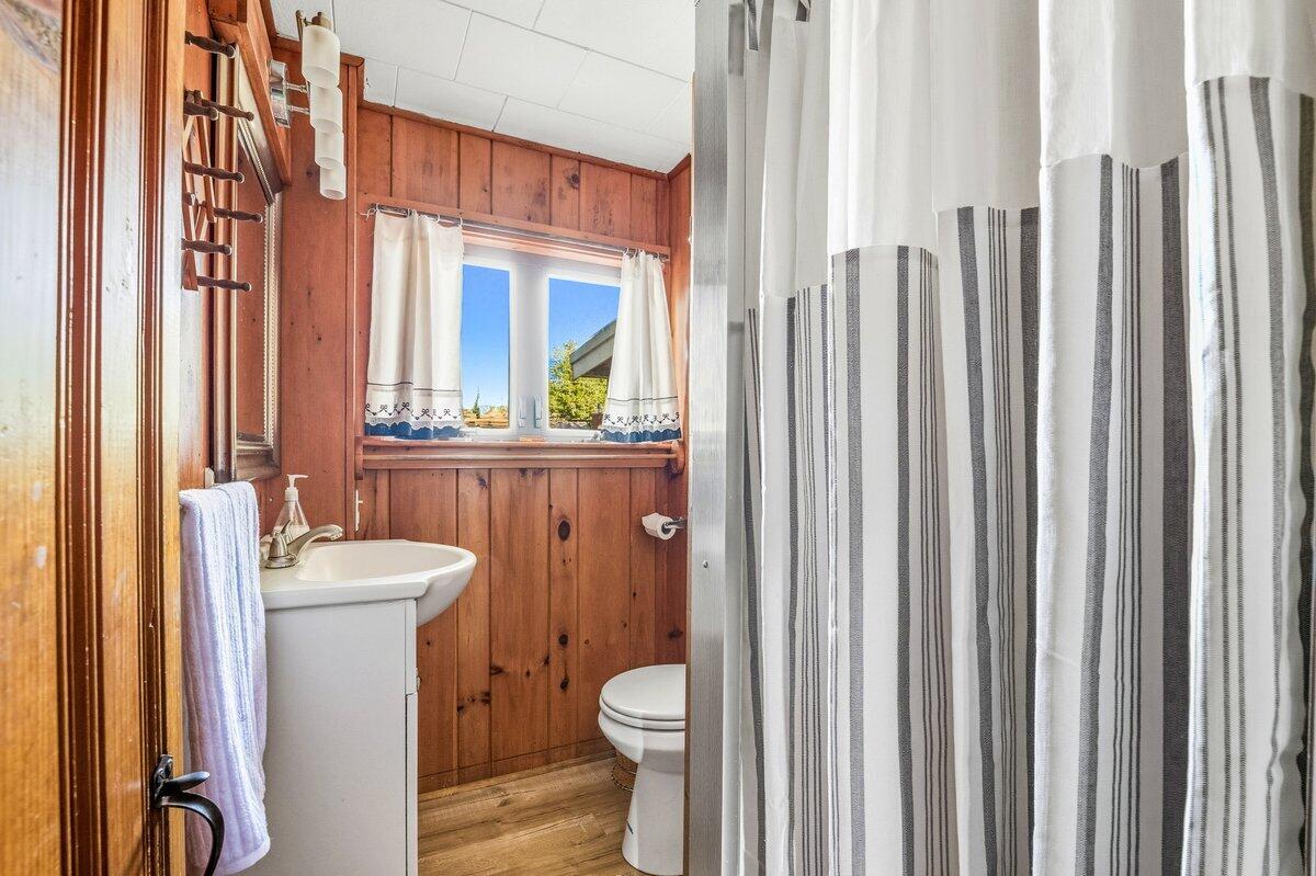 42 Kim Path Mashpee, MA 02649 - Photo 16 of 30 a bathroom with a toilet a sink and a window