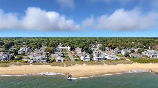an aerial view of residential building and ocean