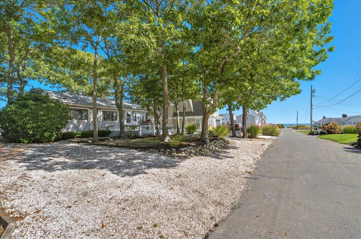 42 Kim Path Mashpee, MA 02649 - Photo 5 of 30 a view of a road with a building in the background