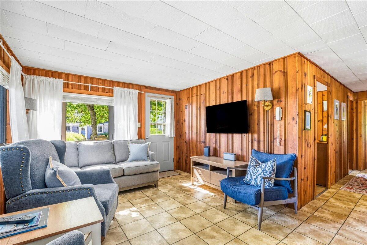 42 Kim Path Mashpee, MA 02649 - Photo 8 of 30 a living room with furniture a flat screen tv and a window