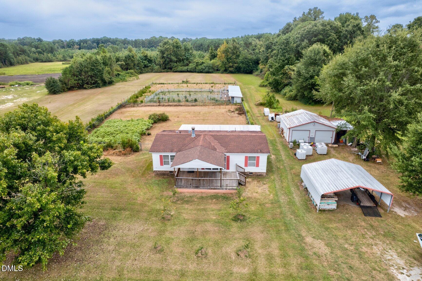 1835 Cokey Road Rocky Mount, NC 27801 - Photo 32 of 42 an aerial view of a house with yard swimming pool and mountain view
