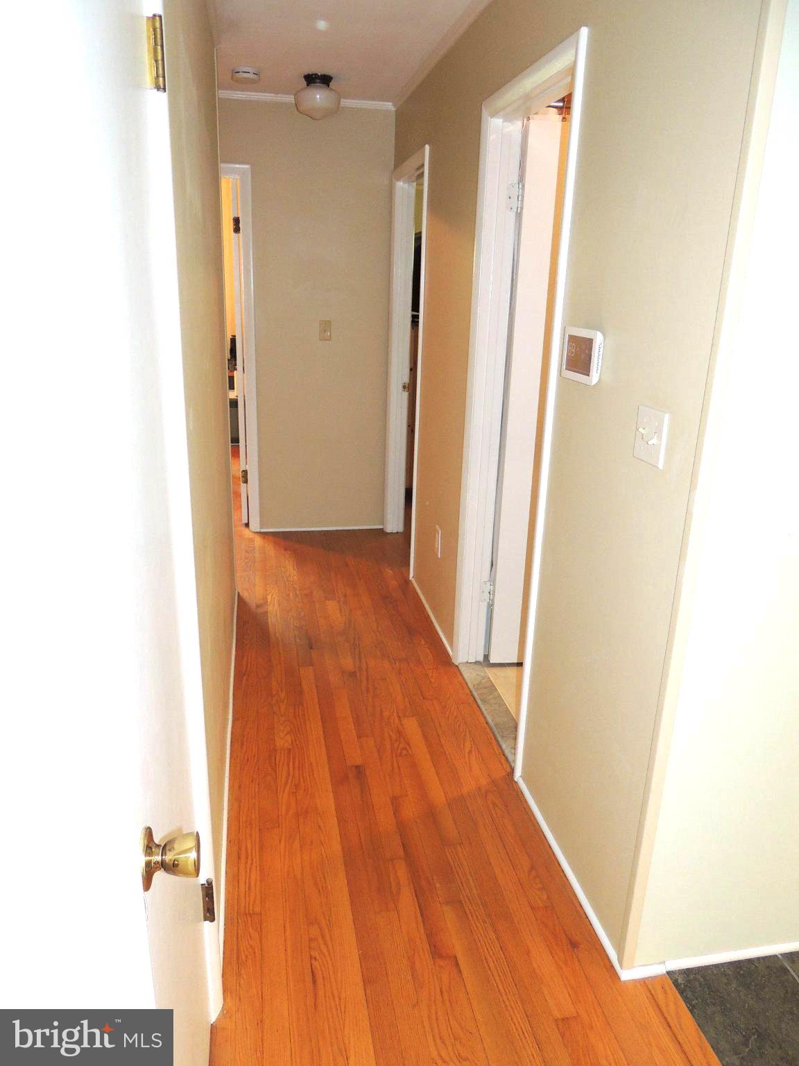 5838 Oklahoma Road Sykesville, MD 21784 - Photo 39 of 72 Inviting hallway with warm wood floors.