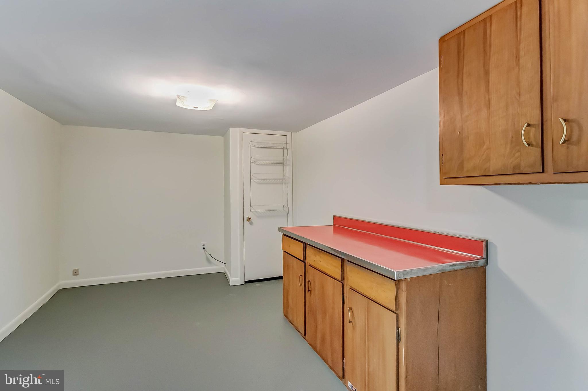 3229 Birchtree Lane Silver Spring, MD 20906 - Photo 40 of 44 Work shop with workbench and cabinets