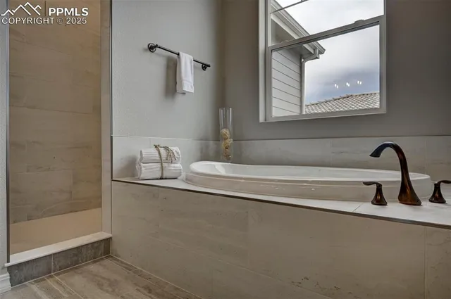 a bathroom with a bathtub and a sink