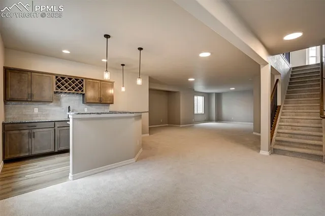 a view of a kitchen with a sink and a stove top oven