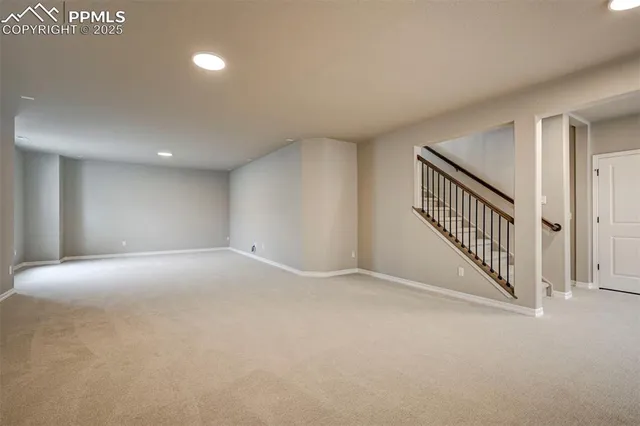 a view of an empty room with stairs