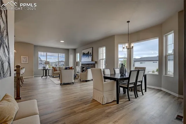 a view of a dining room with furniture window and wooden floor