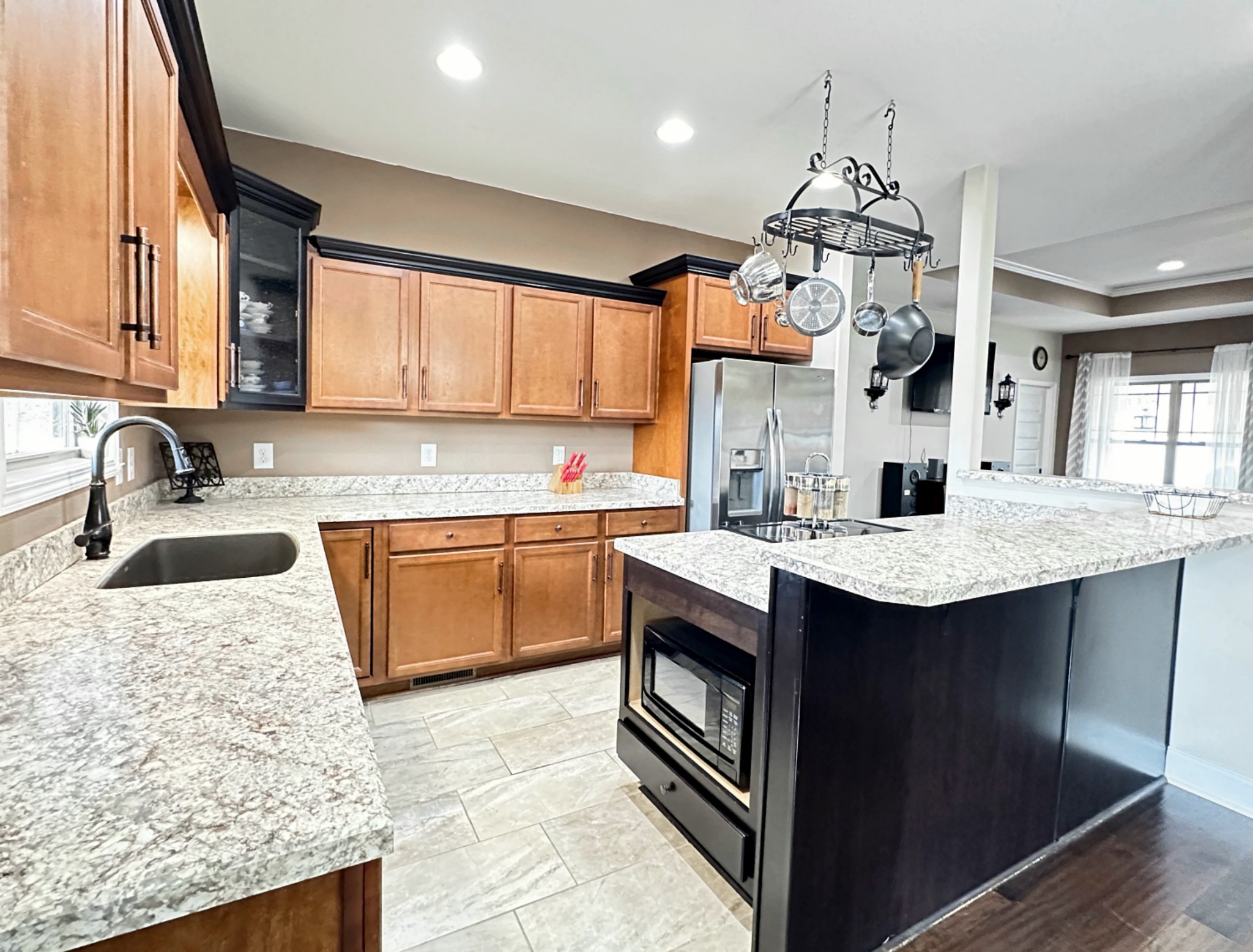 1815 Broome Road Palmyra, TN 37142 - Photo 16 of 61 a kitchen with granite countertop a sink a stove top oven a counter space and cabinets