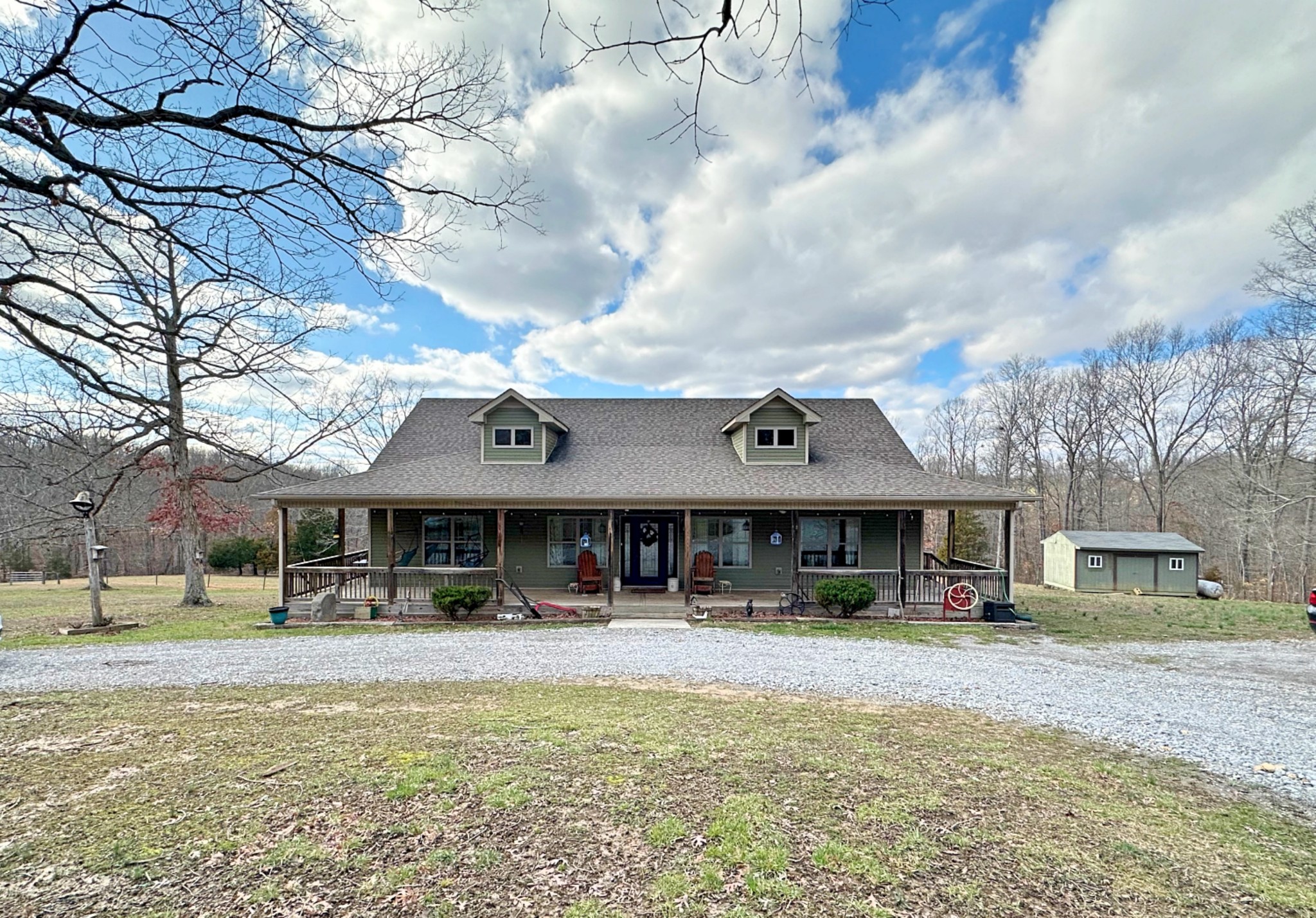 1815 Broome Road Palmyra, TN 37142 - Photo 2 of 61 a front view of a building with street and trees