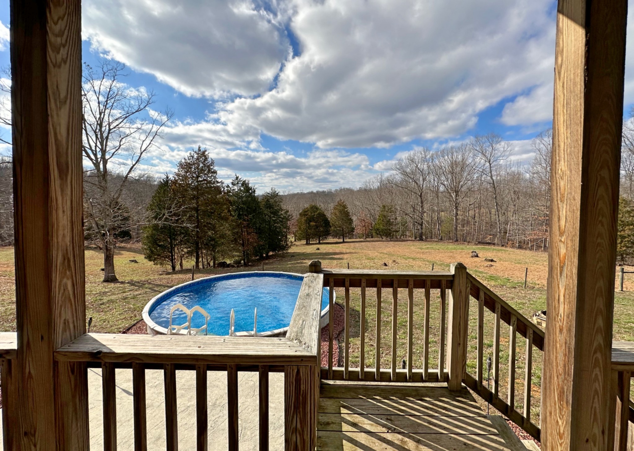 1815 Broome Road Palmyra, TN 37142 - Photo 34 of 61 a view of a balcony with wooden floor and fence