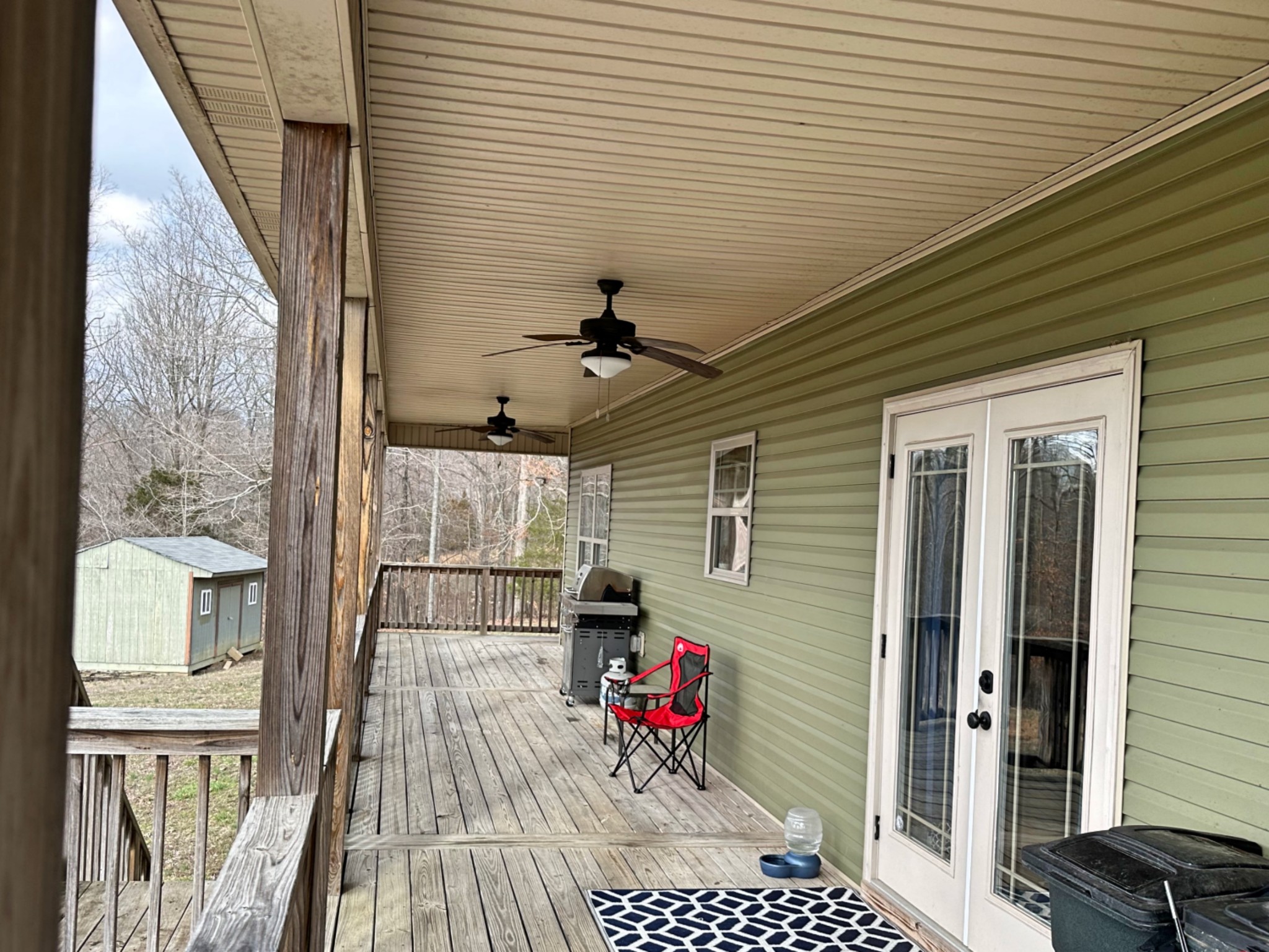 1815 Broome Road Palmyra, TN 37142 - Photo 36 of 61 a view of a balcony with a potted plant