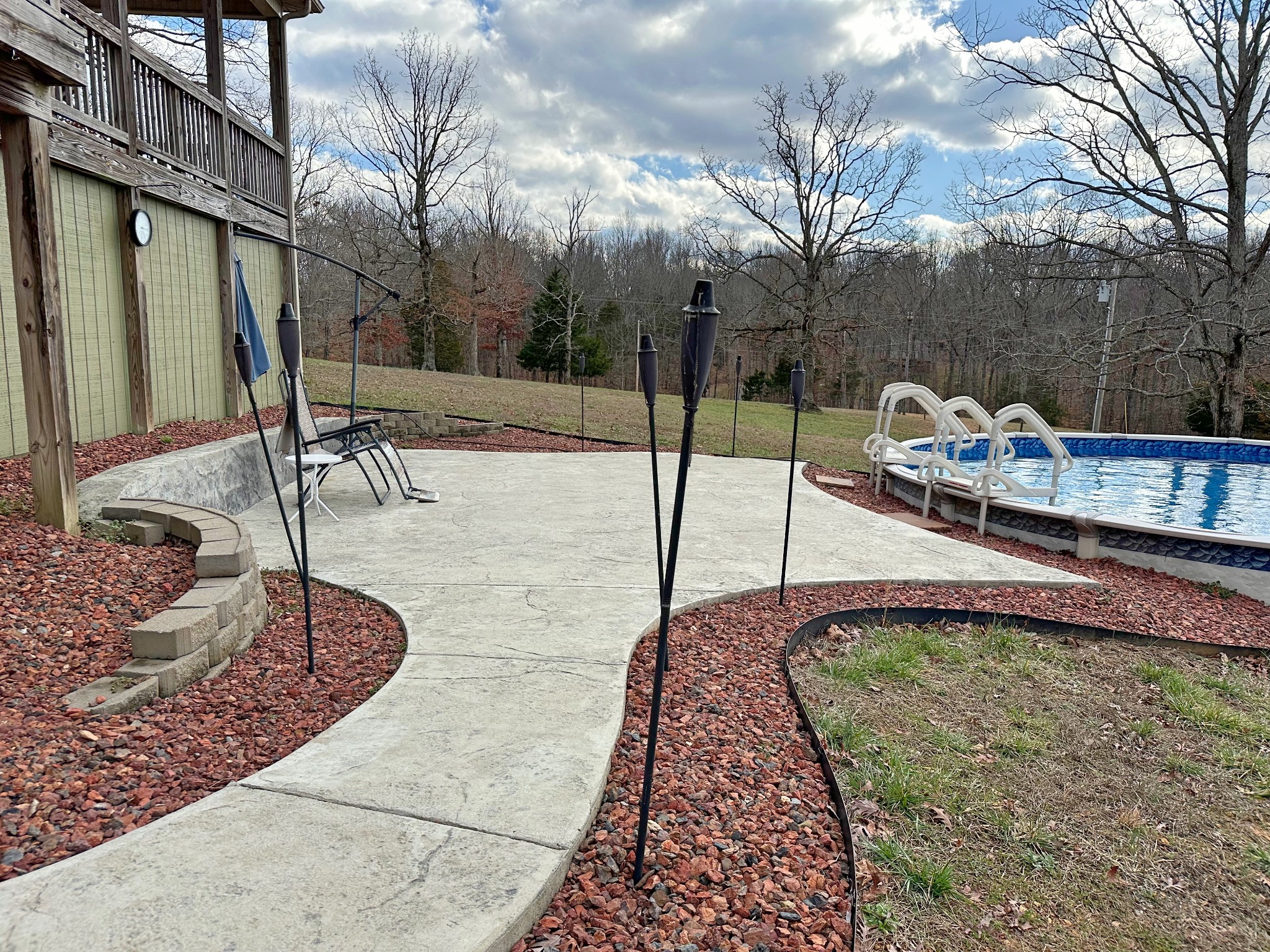 1815 Broome Road Palmyra, TN 37142 - Photo 38 of 61 a view of a swimming pool with a patio