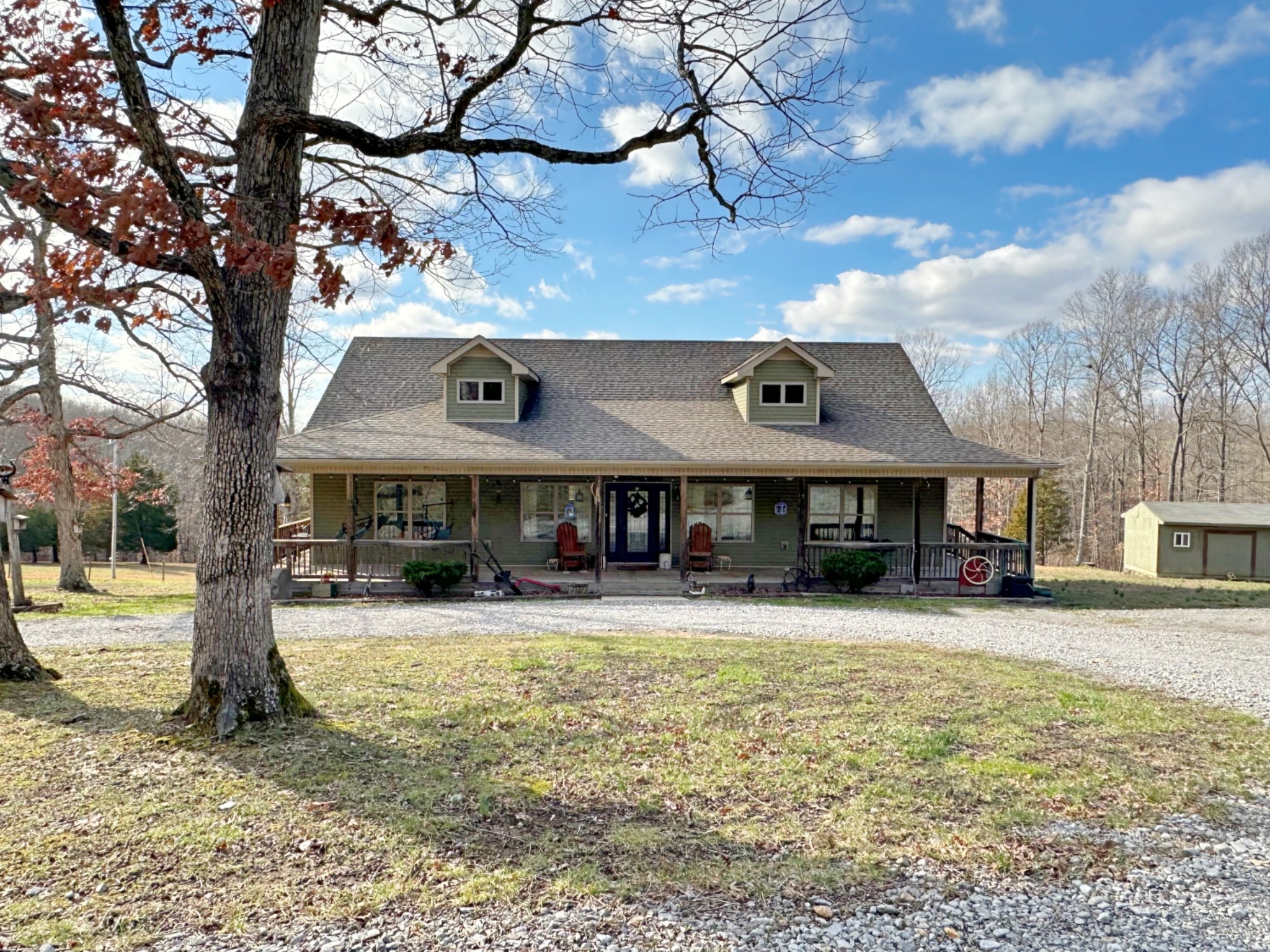 1815 Broome Road Palmyra, TN 37142 - Photo 4 of 61 a front view of a building with a yard