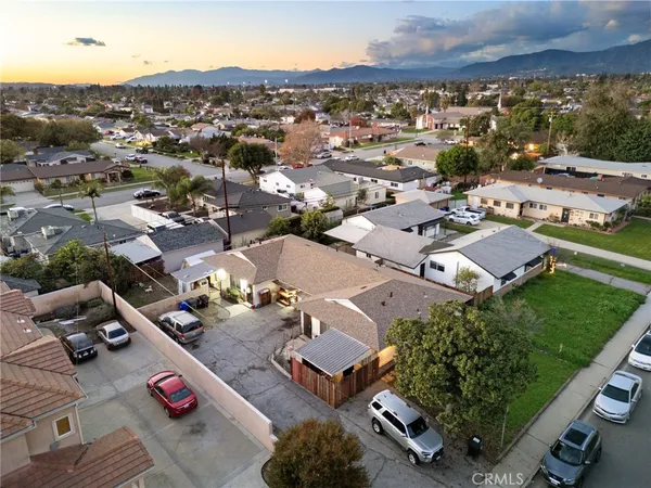 an aerial view of residential houses with outdoor space
