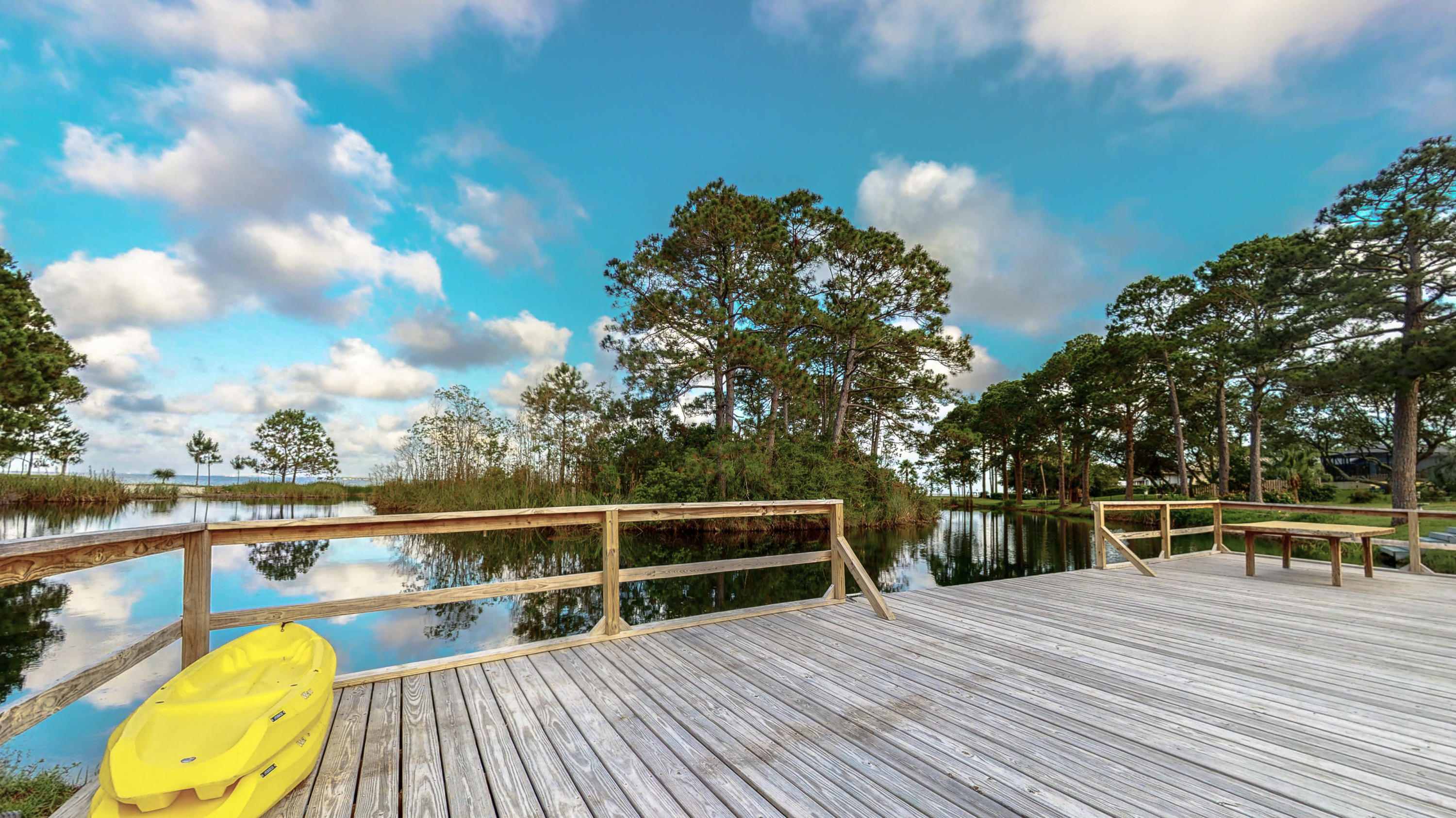 37 Country Club Road Shalimar, FL 32579 - Photo 1 of 64 a view of roof deck with wooden floor and fence