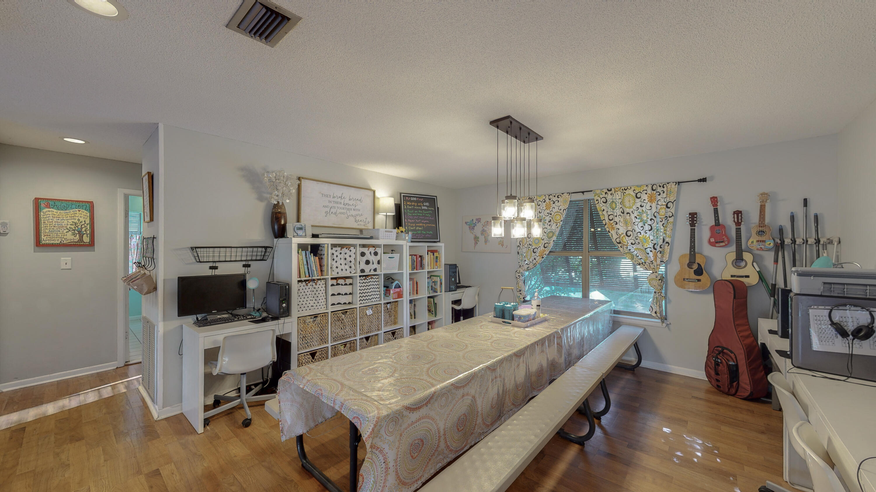 37 Country Club Road Shalimar, FL 32579 - Photo 16 of 64 a room with furniture a flat screen tv and a table